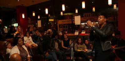 people watching woman singing