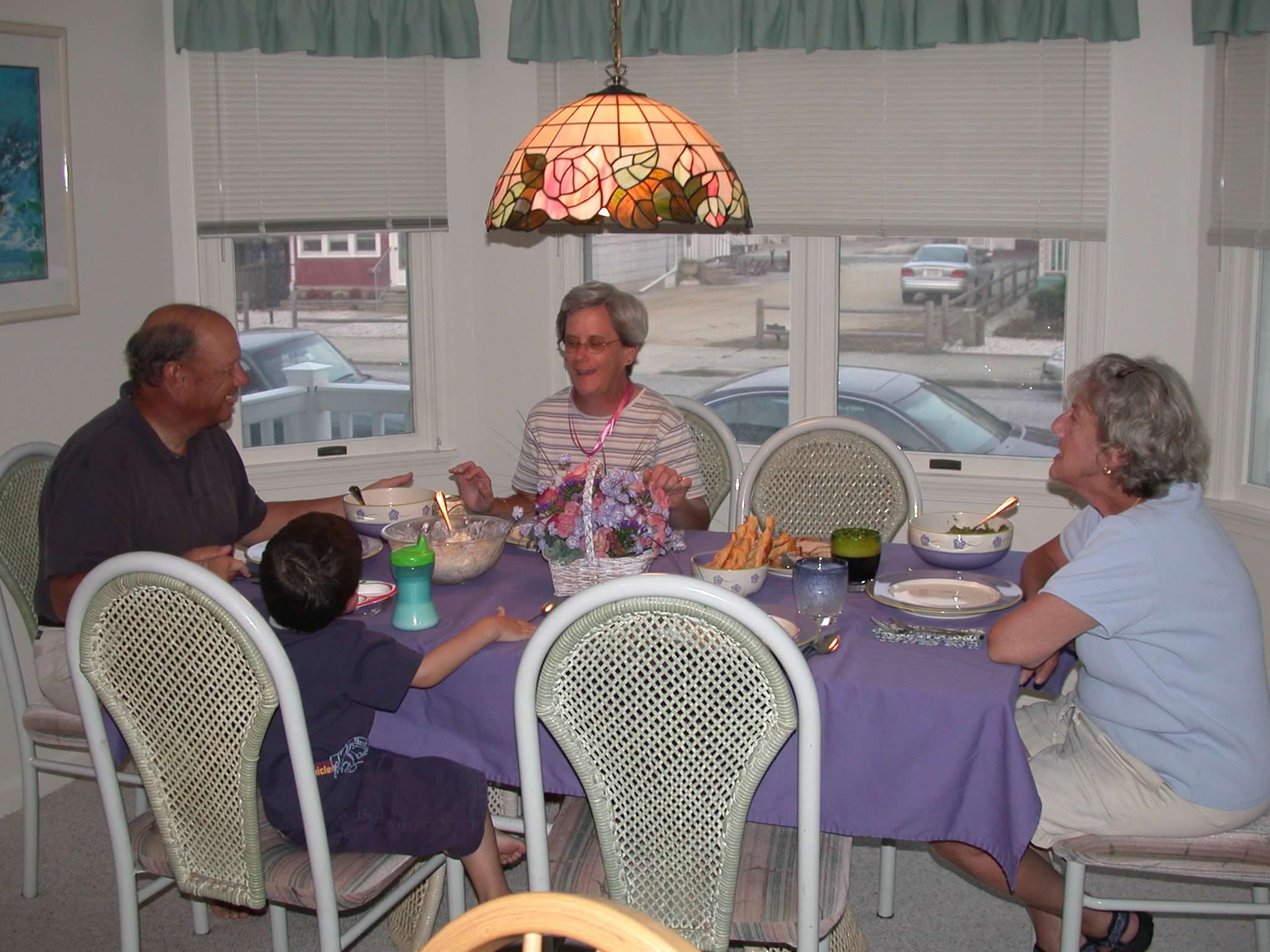 The family sits around the table at 5436 Asbury
