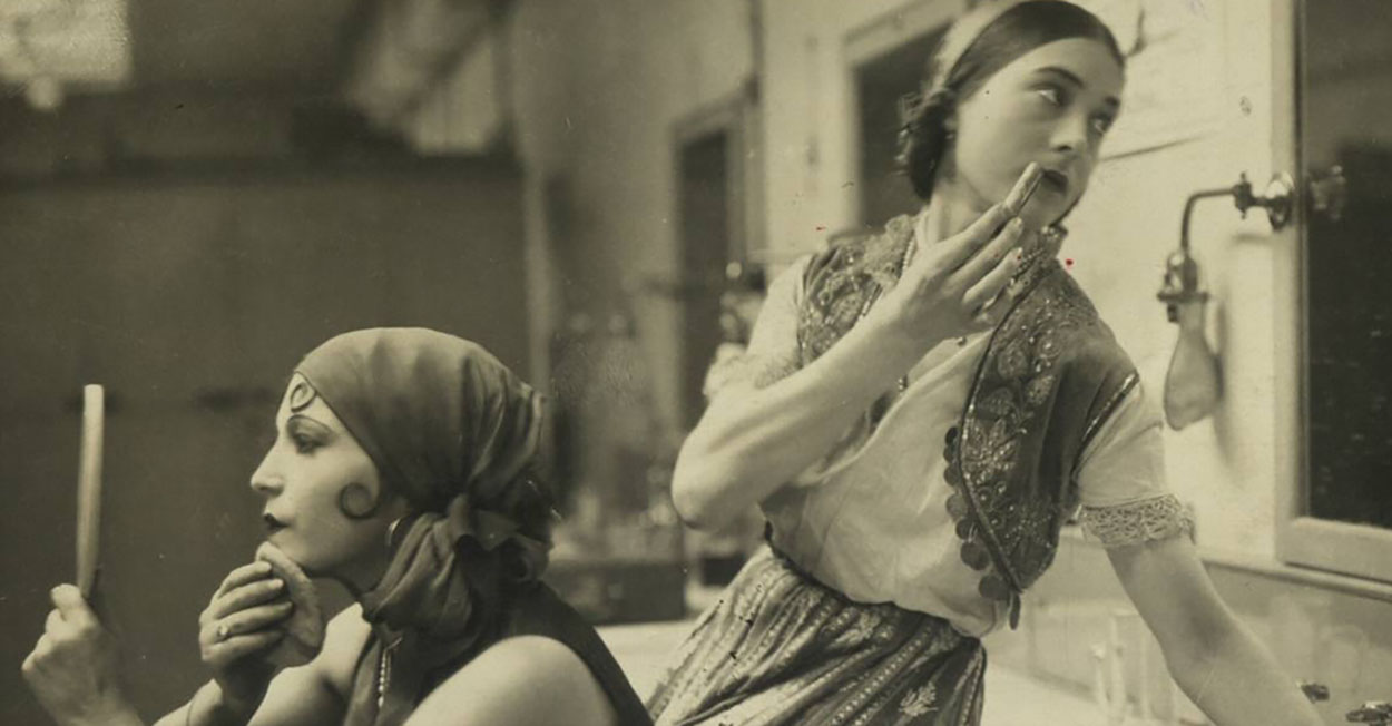 women putting on makeup.