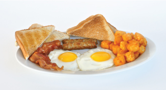 Eggs sunny side up, toast, sausage breakfast